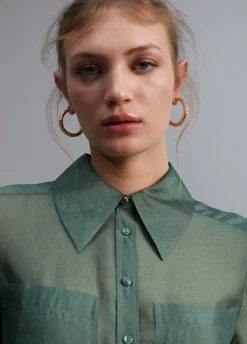 Blusa bolsillos transparencia