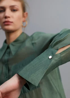 Blusa bolsillos transparencia