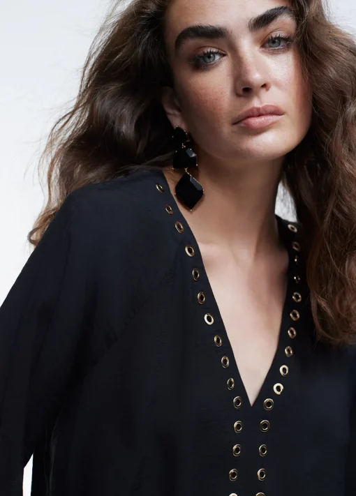 Blusa detalle eyelets
