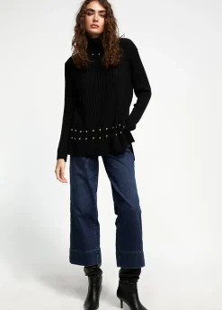 Jersey cuello alto con tachas
