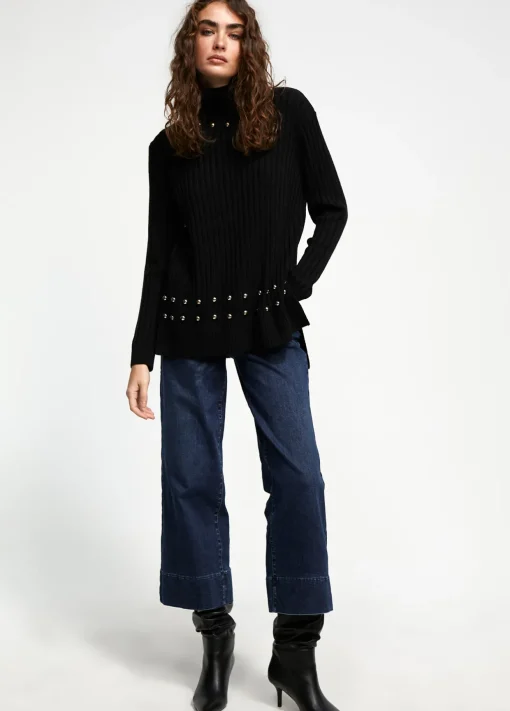 Jersey cuello alto con tachas