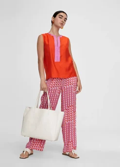 Top bicolor con aberturas