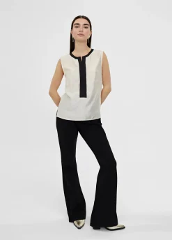 Top bicolor con aberturas
