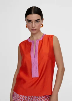 Top bicolor con aberturas