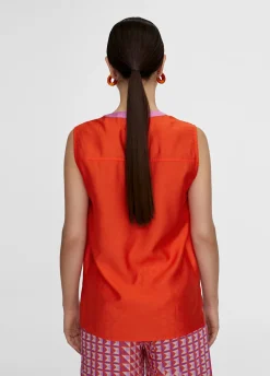 Top bicolor con aberturas
