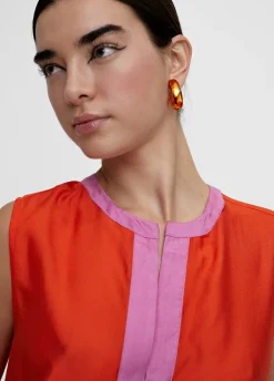 Top bicolor con aberturas