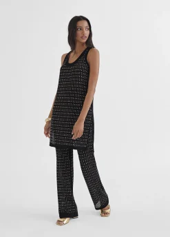 Top largo con piezas metalicas