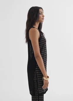 Top largo con piezas metalicas